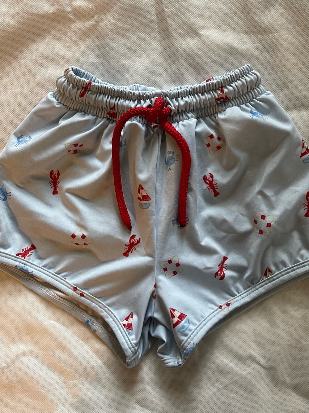 James & Lottie Kids Light Blue Nautical Swim Shorts with Red Drawstring